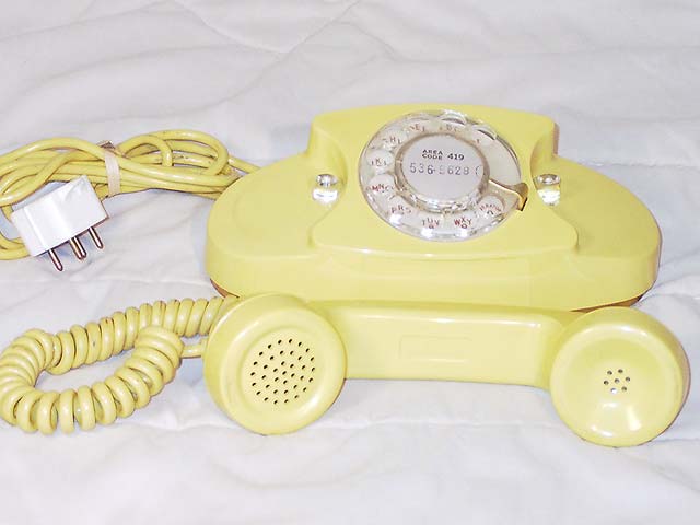 Yellow Rotary Dial Princess phone.